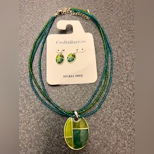 Green necklace with pendant and matching earrings